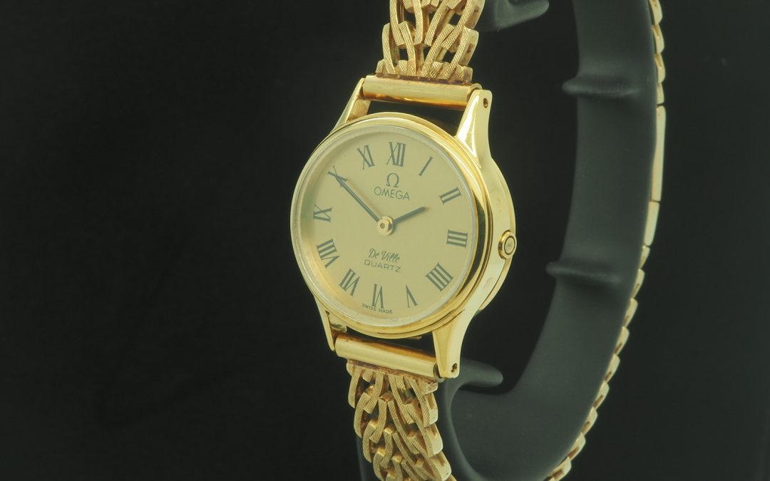 Omega-869 De Ville kultakello kultarannekkeella